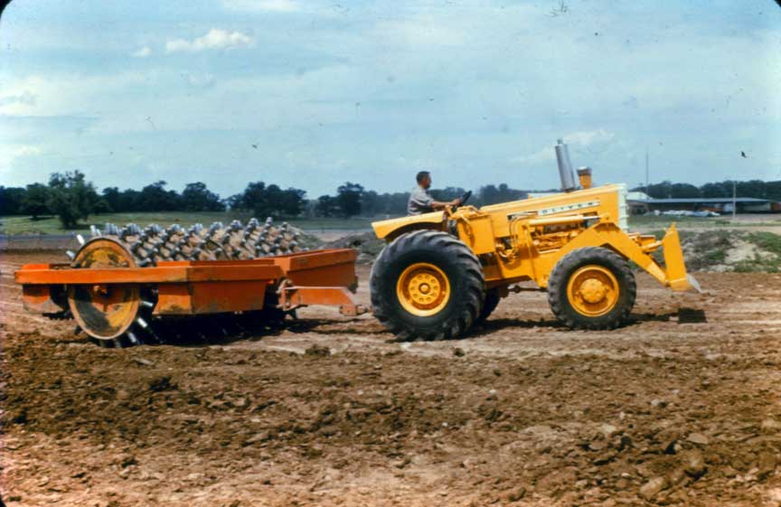 Oliver 4 wheel drive pulling sheeps foot roller c. 1963